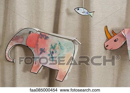 Child's animal drawings hanging on strings View Large Photo Image Picture - Child's animal drawings hanging on strings. Fotosearch