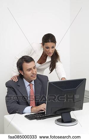 Colleagues working together View Large Photo Image Stock Image - Colleagues working together. Fotosearch