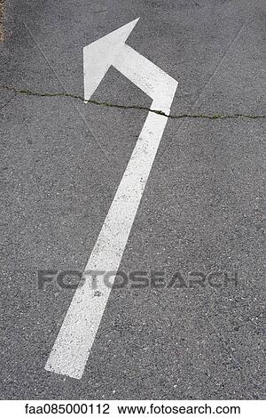 Stock Image - Direction arrow on pavement. Fotosearch