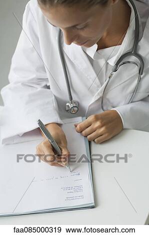 Stock Photo - Doctor writing prescription. Fotosearch