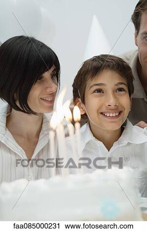 Stock Image - Family celebrating birthday. Fotosearch