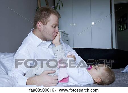 Father and baby View Large Photo Image Stock Photo - Father and baby. Fotosearch