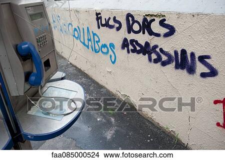 Graffiti painted on wall near payphone View Large Photo Image Picture - Graffiti painted on wall near payphone. Fotosearch