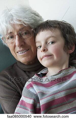 Stock Image - Grandmother and young grandson, portrait. Fotosearch