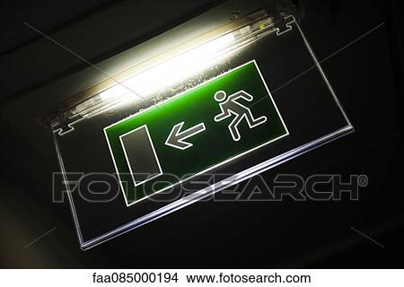 Illuminated emergency exit sign View Large Photo Image Picture - Illuminated emergency exit sign. Fotosearch