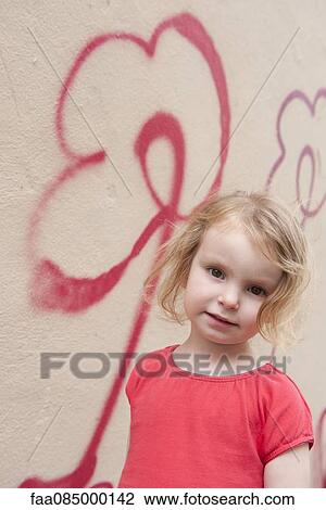 Little girl by wall with flower graffiti, portrait View Large Photo Image Stock Image - Little girl by wall with flower graffiti, portrait. Fotosearch
