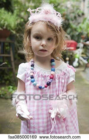 Stock Photo - Little girl dressed up in costume, portrait. Fotosearch