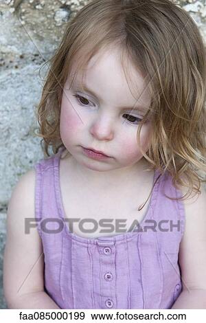 Little girl looking down, portrait View Large Photo Image Stock Photo - Little girl looking down, portrait. Fotosearch
