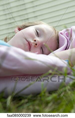 Little girl napping outdoors View Large Photo Image Stock Photo - Little girl napping outdoors. Fotosearch
