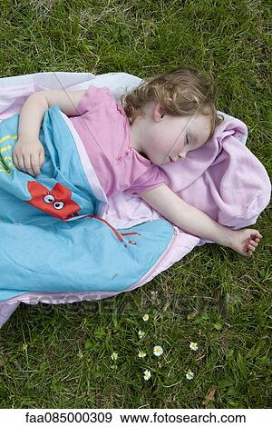 Little girl napping outdoors View Large Photo Image Stock Photo - Little girl napping outdoors. Fotosearch