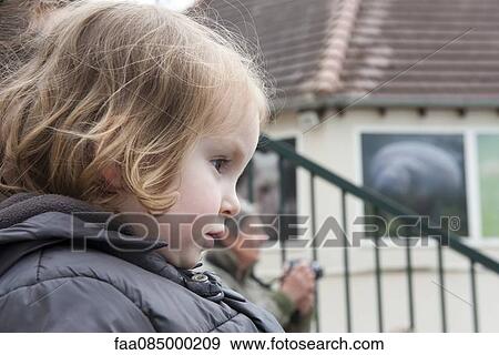 Little girl outdoors, looking away attentively View Large Photo Image Stock Photo - Little girl outdoors, looking away attentively. Fotosearch