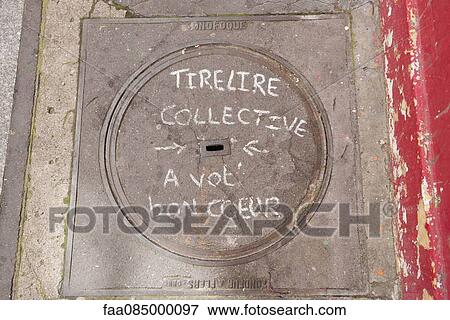 Manhole cover with writing in chalk saying "piggy bank collection, have a good heart" View Large Photo Image Stock Photo - Manhole cover with writing in chalk saying "piggy bank collection, have a good heart". Fotosearch