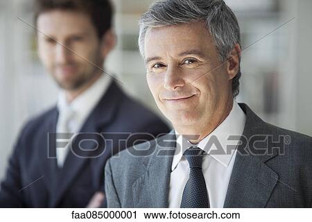 Stock Image - Mature business man, portrait. Fotosearch