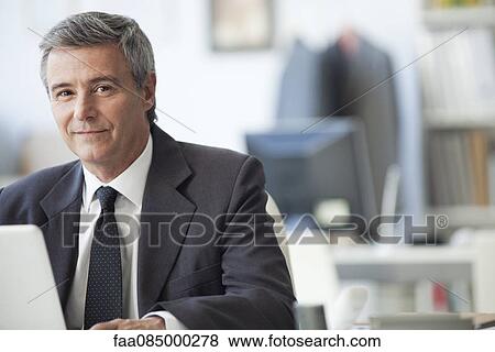 Mature businessman in office, portrait View Large Photo Image Stock Photo - Mature businessman in office, portrait. Fotosearch