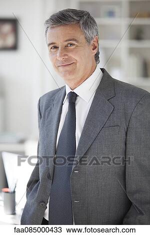 Stock Image - Mature businessman, portrait. Fotosearch