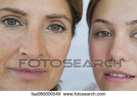 Stock Photo - Mature mother and adult daughter, portrait. Fotosearch