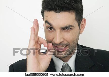 Mid-adult businessman making ok gesture View Large Photo Image Stock Photography - Mid-adult businessman making ok gesture. Fotosearch