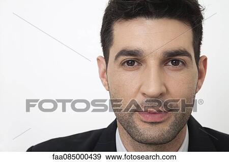 Stock Photo - Mid-adult businessman, portrait. Fotosearch