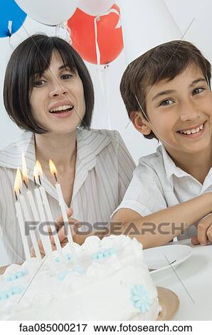 Stock Photo - Mother and son celebrating birthday. Fotosearch