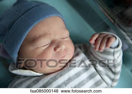 Stock Photo - Newborn baby sleeping. Fotosearch