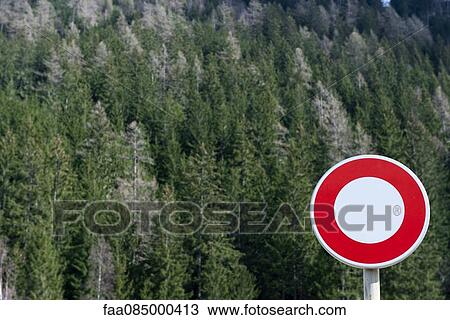 Stock Image - No vehicles sign in front of forest. Fotosearch