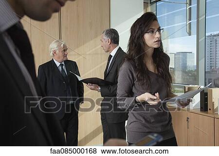 Professionals working in office View Large Photo Image Stock Photo - Professionals working in office. Fotosearch