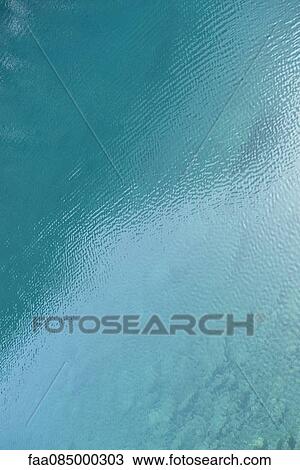 Stock Image - Rippled water surface. Fotosearch