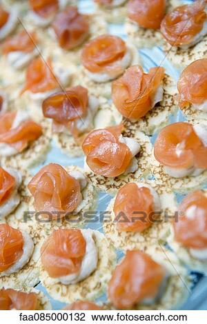 Smoked salmon on blinis View Large Photo Image Stock Image - Smoked salmon on blinis. Fotosearch