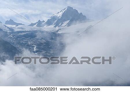 Snow-capped mountain and glacier View Large Photo Image Stock Image - Snow-capped mountain and glacier. Fotosearch