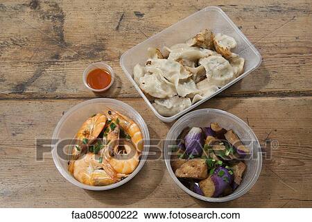 Stock Image - Take-out food in plastic containers. Fotosearch