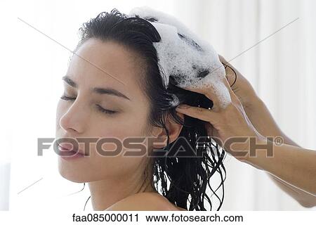 Woman having her hair shampooed View Large Photo Image Stock Image - Woman having her hair shampooed. Fotosearch