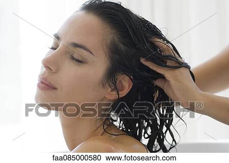 Woman having her head massaged View Large Photo Image Stock Image - Woman having her head massaged. Fotosearch
