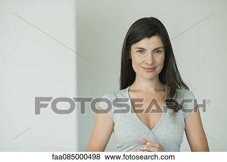 Stock Photo - Woman smiling, portrait. Fotosearch