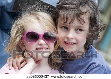 Stock Photo - Young siblings, portrait. Fotosearch