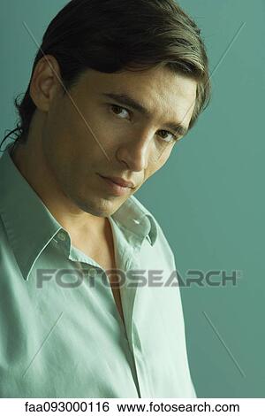 Stock Photograph - Attractive man looking seductively at camera. Fotosearch