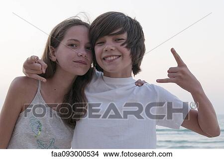 Picture - Brother and sister at the beach, portrait. Fotosearch
