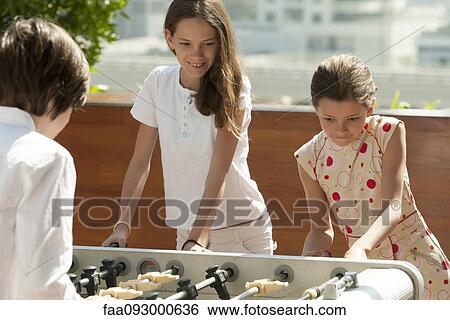 Children playing foosball View Large Photo Image Stock Photograph - Children playing foosball. Fotosearch