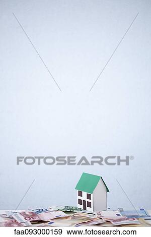 Debt overwhelms real estate investment View Large Photo Image Stock Photo - Debt overwhelms real estate investment. Fotosearch