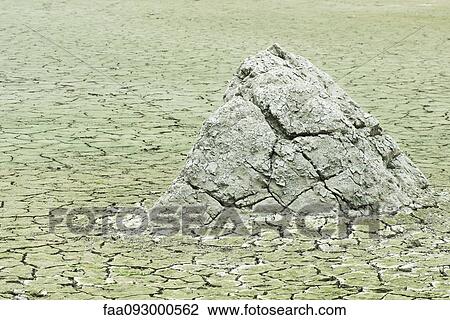Dry, cracked earth in barren landscape View Large Photo Image Stock Image - Dry, cracked earth in barren landscape. Fotosearch