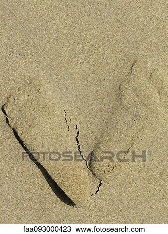 Stock Image - Footprints in sand. Fotosearch