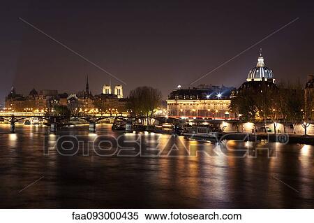 France, Paris, Seine River illuminated at night View Large Photo Image Stock Photography - France, Paris, Seine River illuminated at night. Fotosearch