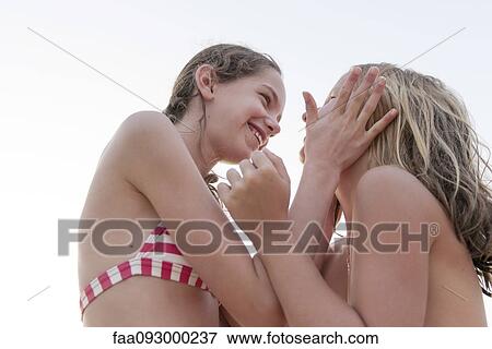 Friends bonding at the beach View Large Photo Image Stock Photo - Friends bonding at the beach. Fotosearch