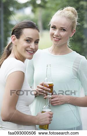 Friends drinking beer together View Large Photo Image Stock Photograph - Friends drinking beer together. Fotosearch