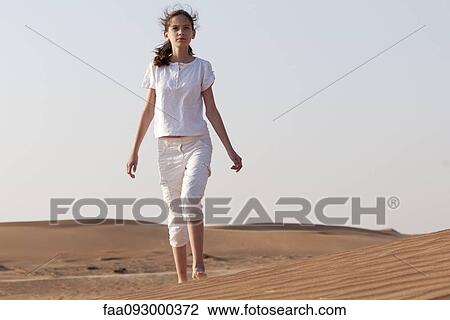 Girl with forlorn expression alone in desert View Large Photo Image Stock Image - Girl with forlorn expression alone in desert. Fotosearch