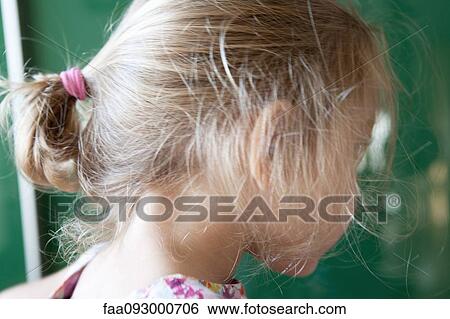 Girl with messy ponytail, side view View Large Photo Image Stock Photograph - Girl with messy ponytail, side view. Fotosearch