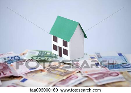 Stock Image - Home ownership becomes burden when debt exceeds property value. Fotosearch