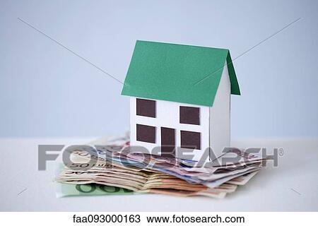 Stock Image - Home ownership becomes burden when debt exceeds property value. Fotosearch