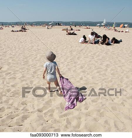 Infant walking on beach, dragging blanket behind him View Large Photo Image Stock Image - Infant walking on beach, dragging blanket behind him. Fotosearch