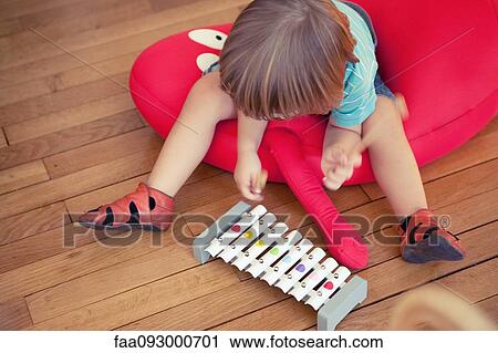 Little boy playing toy xylophone View Large Photo Image Stock Image - Little boy playing toy xylophone. Fotosearch