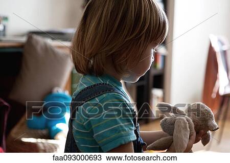 Little boy playing with stuffed toy View Large Photo Image Stock Image - Little boy playing with stuffed toy. Fotosearch